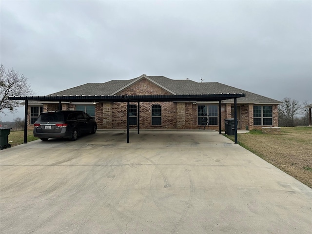 single story home featuring a front yard and a carport