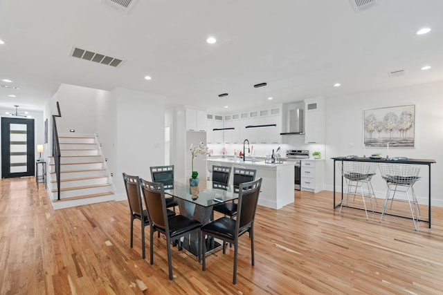 dining room featuring light hardwood / wood-style floors and sink