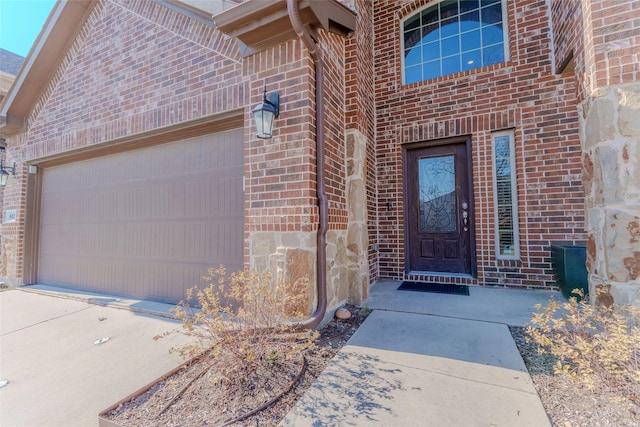 doorway to property featuring a garage