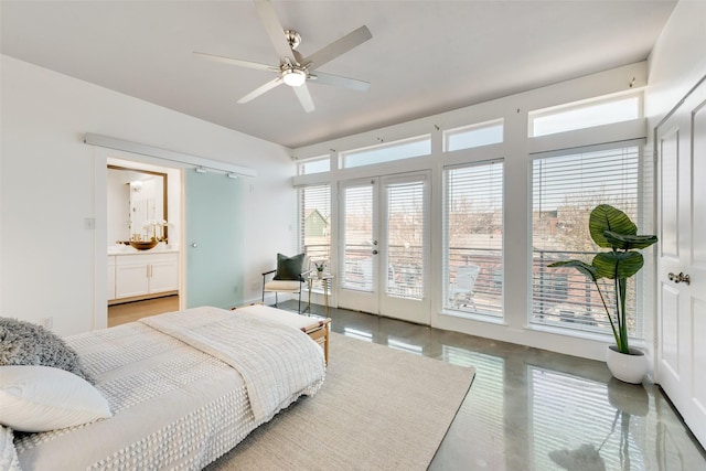 bedroom with french doors, concrete flooring, access to outside, ceiling fan, and connected bathroom