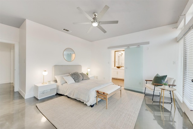 bedroom featuring ceiling fan and ensuite bathroom