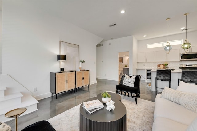 living room featuring concrete flooring