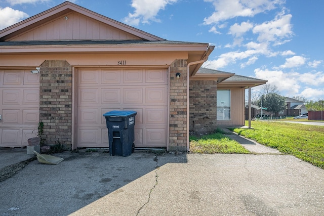 exterior space with a garage and a front yard