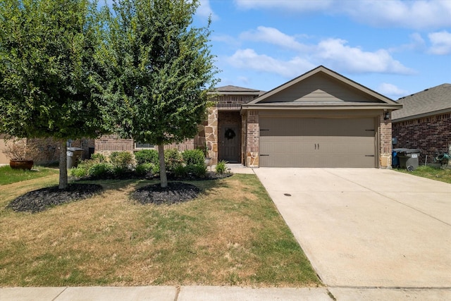 view of front of property with a garage and a front lawn