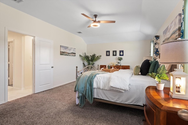 bedroom with ceiling fan, lofted ceiling, and light carpet