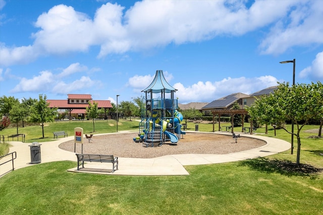 view of jungle gym featuring a lawn