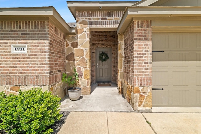 doorway to property featuring a garage