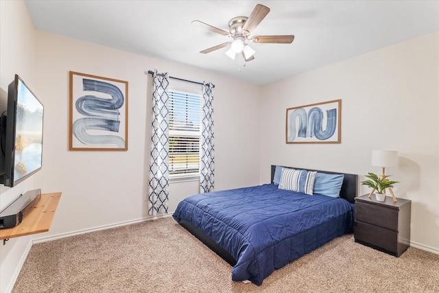 bedroom featuring ceiling fan and light colored carpet