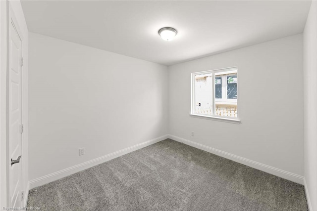 unfurnished room with carpet floors