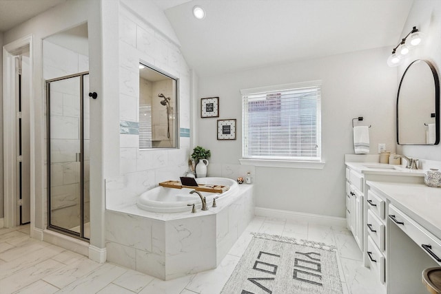 bathroom featuring separate shower and tub, vanity, and vaulted ceiling