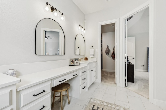 bathroom with ceiling fan and vanity