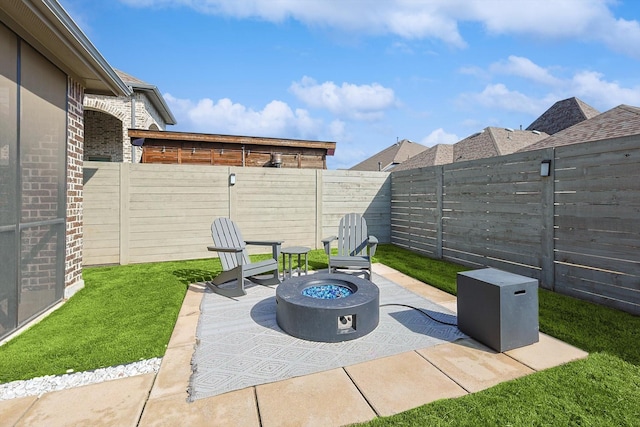 view of patio / terrace featuring an outdoor fire pit