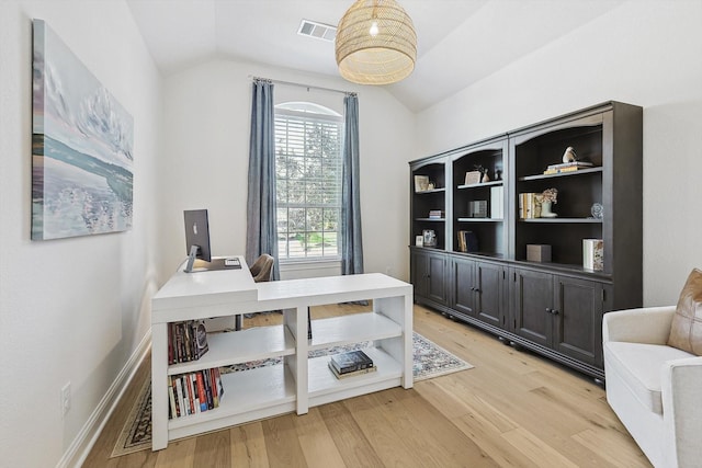 office featuring light hardwood / wood-style floors, a wealth of natural light, and vaulted ceiling