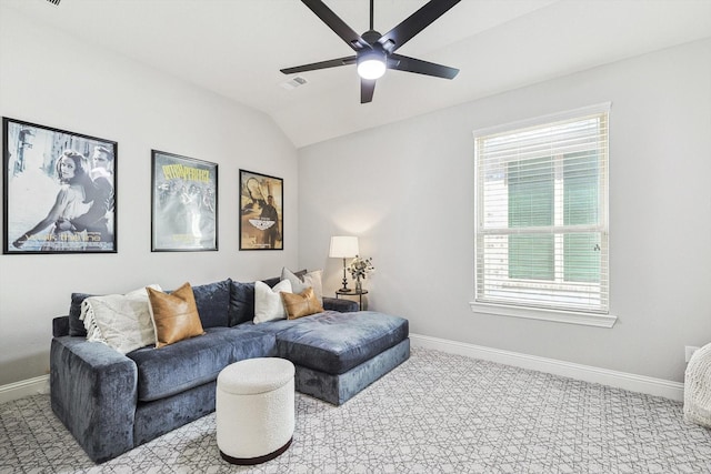 living room with ceiling fan and lofted ceiling