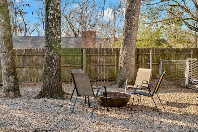 view of patio featuring an outdoor fire pit