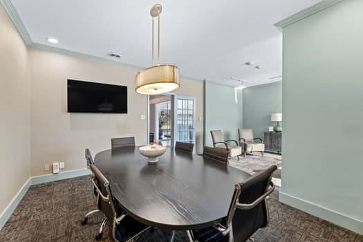 dining room with dark colored carpet