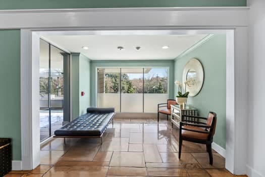 living area featuring ornamental molding