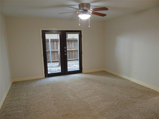 unfurnished room with carpet floors, ceiling fan, and french doors