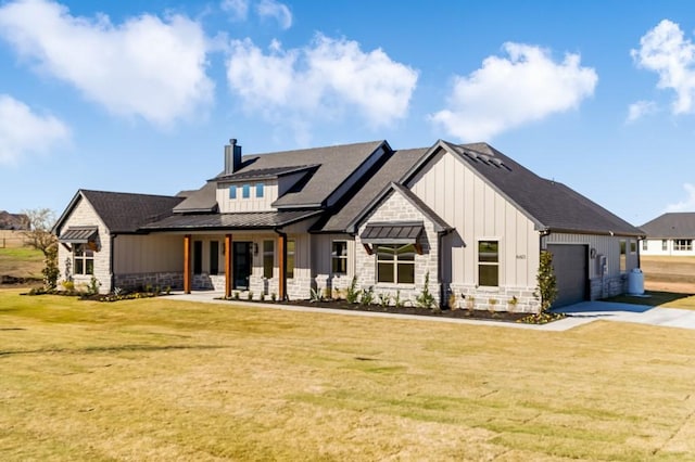 modern farmhouse style home with a front yard and a garage