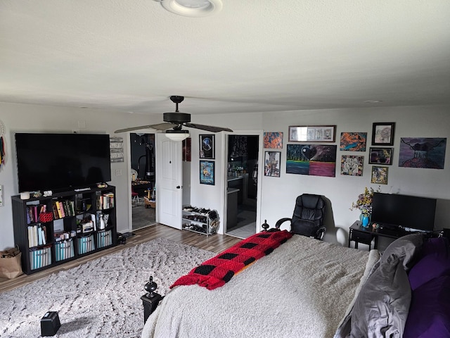 bedroom with hardwood / wood-style flooring and ceiling fan