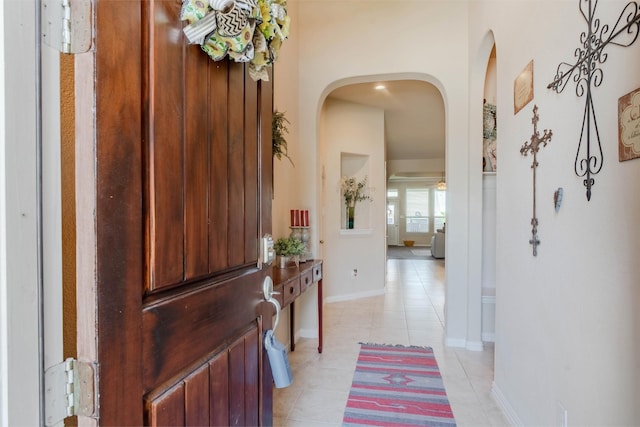 entryway with light tile patterned floors