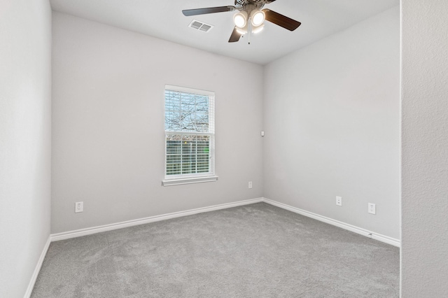 unfurnished room with ceiling fan and light colored carpet