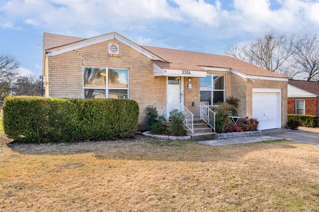 ranch-style house with a garage and a front yard