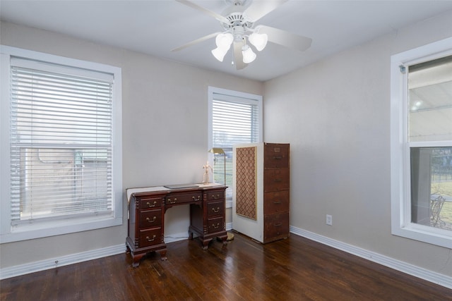 home office with dark hardwood / wood-style floors and ceiling fan