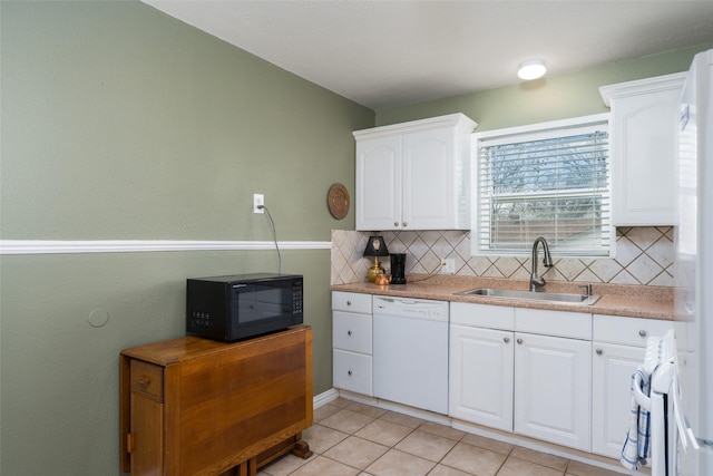 kitchen with white cabinetry, white appliances, tasteful backsplash, and a sink