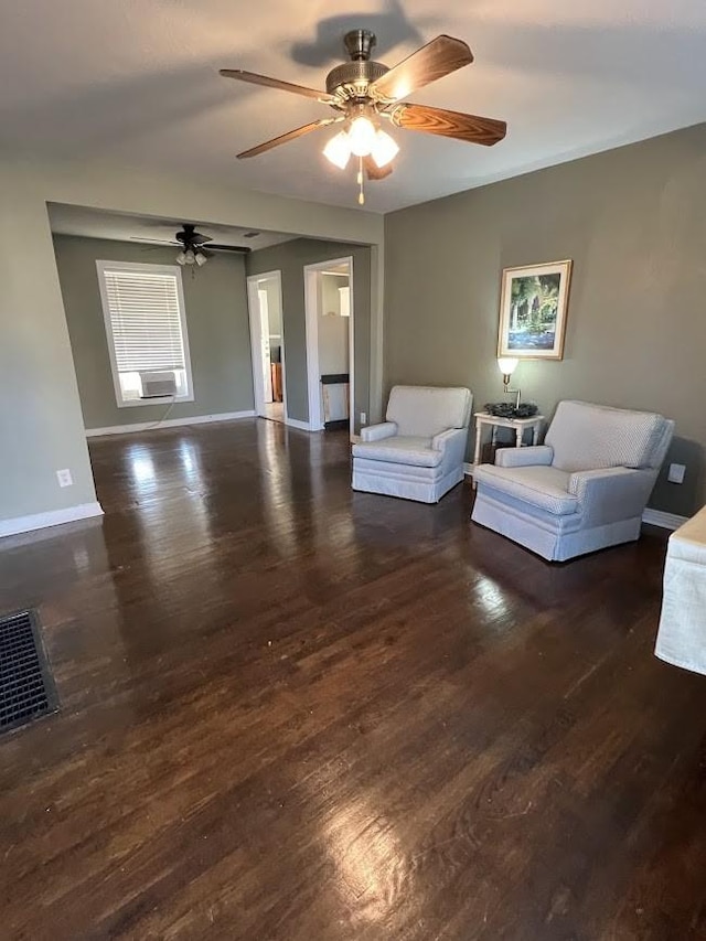 living room featuring cooling unit and dark wood-type flooring