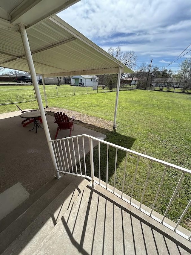 deck featuring a yard and a patio area