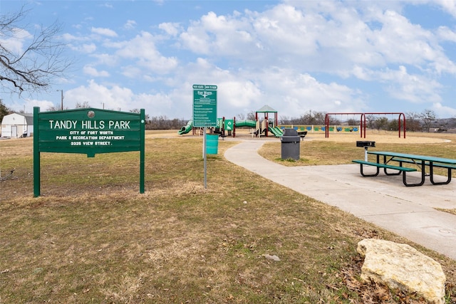 surrounding community featuring playground community and a yard