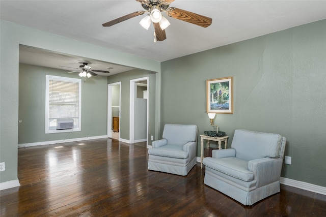 sitting room featuring cooling unit and dark hardwood / wood-style flooring