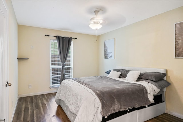 bedroom featuring dark hardwood / wood-style flooring and ceiling fan