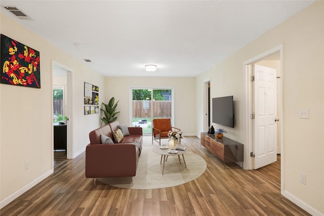 living room featuring dark wood-type flooring