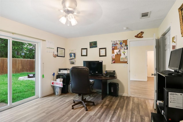 office area with hardwood / wood-style flooring and ceiling fan