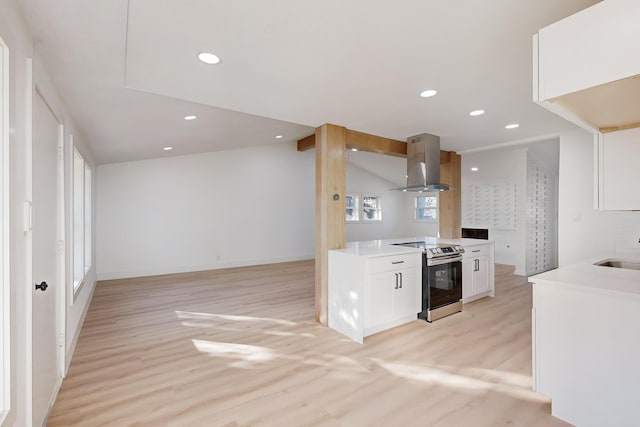 kitchen featuring electric range, sink, light hardwood / wood-style flooring, extractor fan, and white cabinets