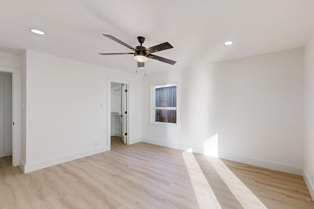 empty room featuring light hardwood / wood-style floors and ceiling fan