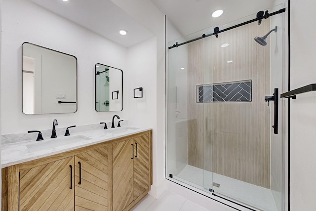 bathroom with vanity, tile patterned floors, and a shower with shower door