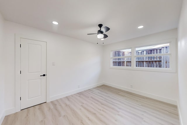 unfurnished room with ceiling fan and light hardwood / wood-style floors