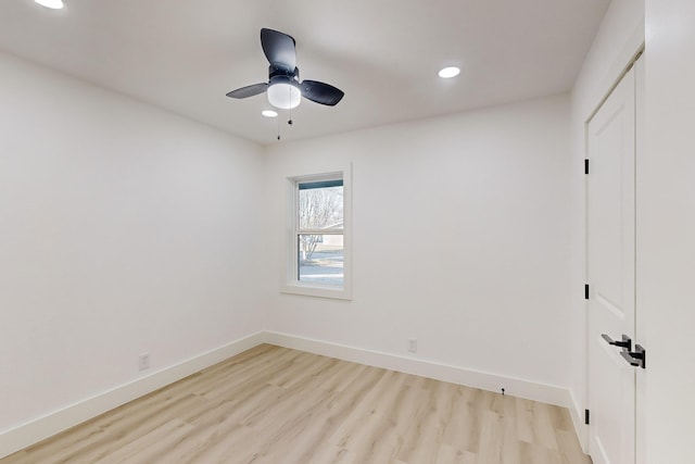 empty room with light hardwood / wood-style flooring and ceiling fan