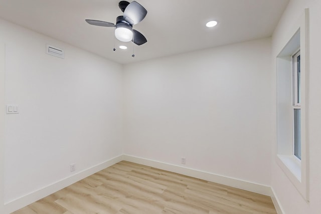 empty room featuring light hardwood / wood-style flooring and ceiling fan