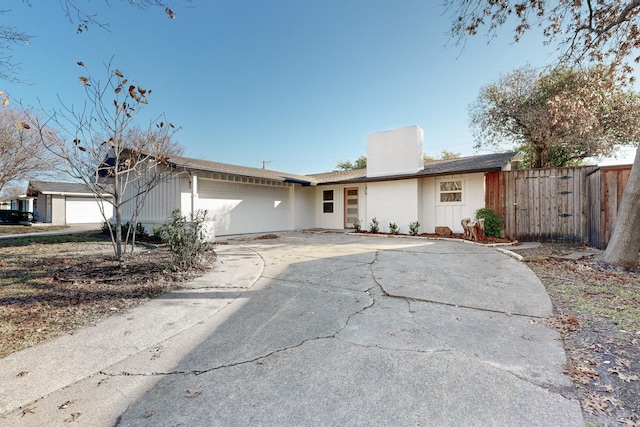 ranch-style home with a garage