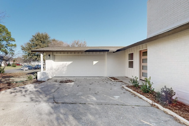 view of side of property featuring a garage