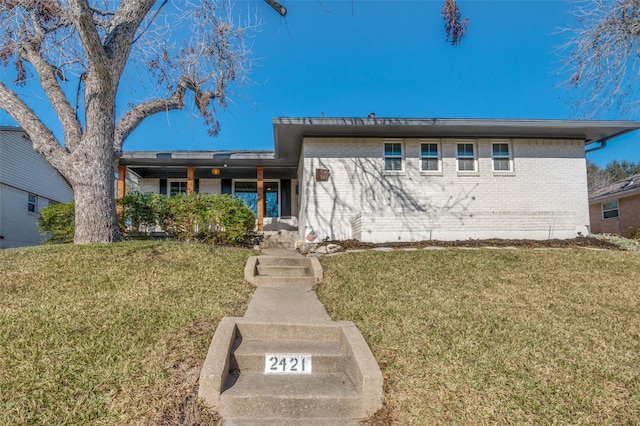 view of front of home with a front lawn