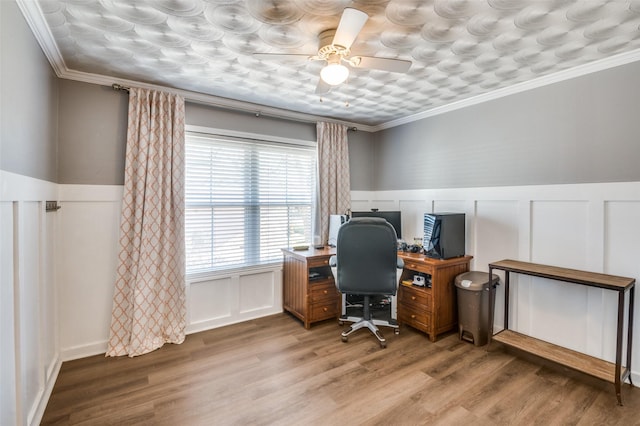 office space featuring hardwood / wood-style floors, ceiling fan, and ornamental molding