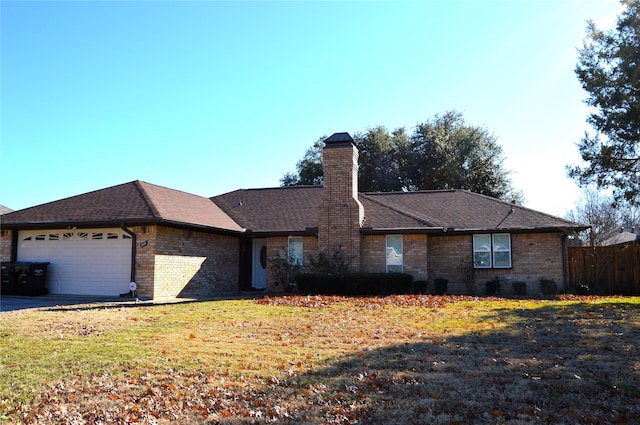 single story home with a garage and a front yard