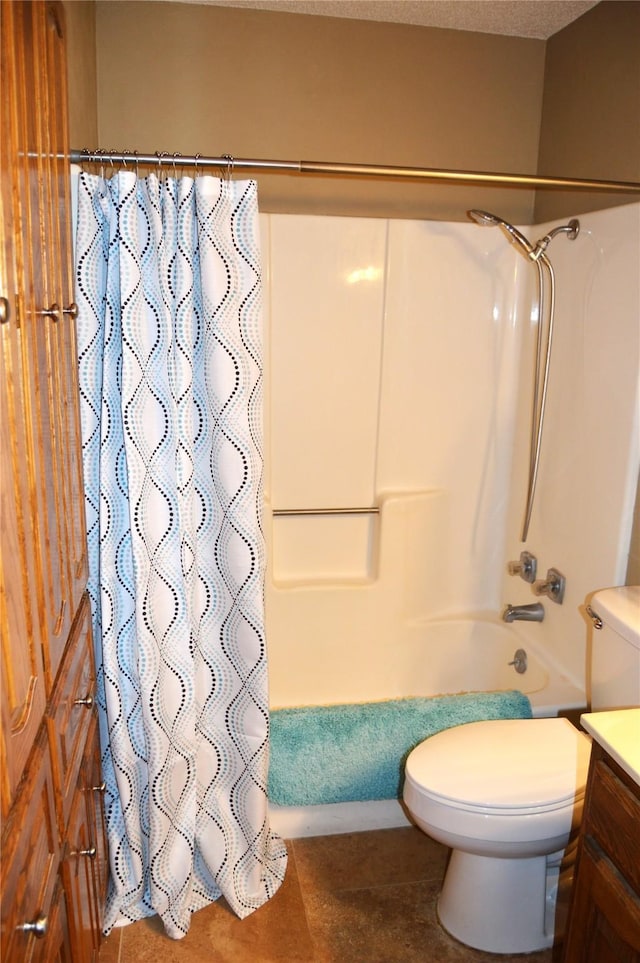 full bathroom with shower / tub combo with curtain, vanity, toilet, and a textured ceiling