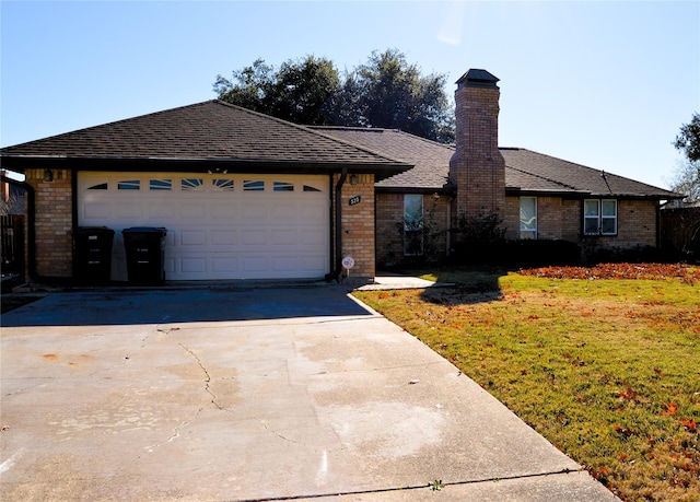 ranch-style home with a garage and a front yard