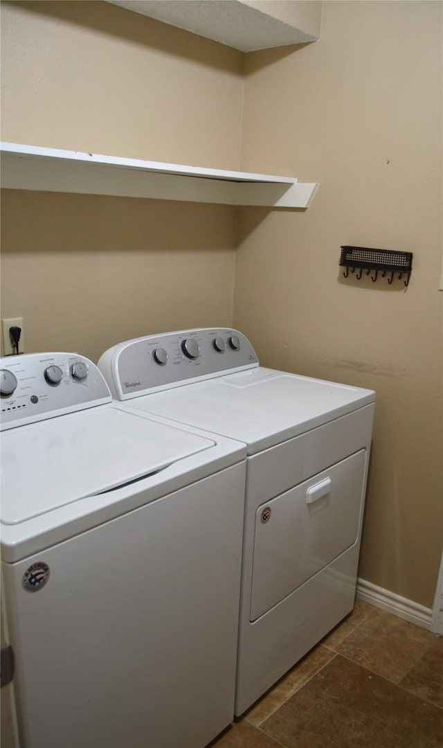 clothes washing area featuring separate washer and dryer